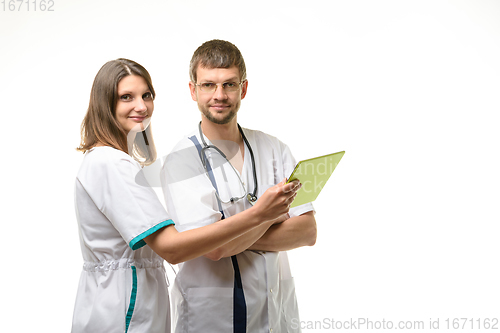 Image of Two doctors discuss the test results and looked at the frame