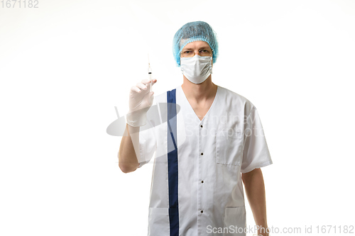 Image of Surgeon holding a syringe in his hands and looking into the frame, isolated on white background