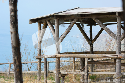 Image of Homemade gazebo from a wooden log house