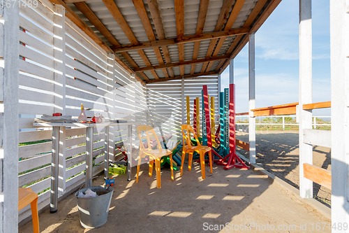 Image of Open room under a canopy on a horse farm, for storing various implements