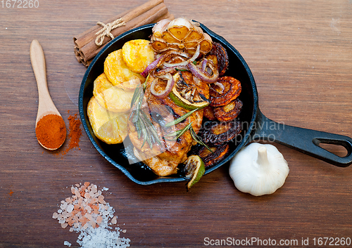 Image of roasted grilled BBQ chicken breast with herbs and spices 