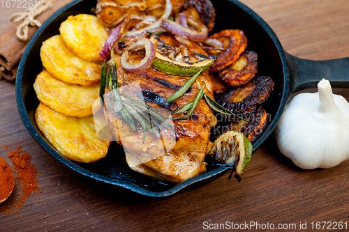 Image of roasted grilled BBQ chicken breast with herbs and spices 