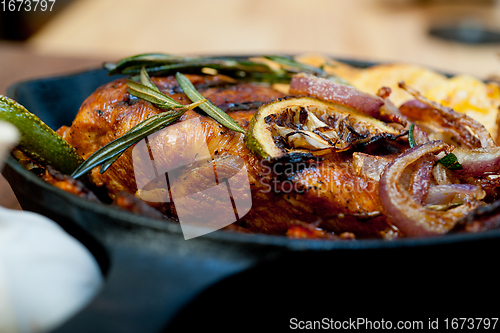 Image of roasted grilled BBQ chicken breast with herbs and spices 