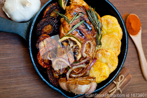 Image of roasted grilled BBQ chicken breast with herbs and spices 