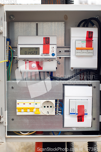 Image of An introductory machine and an electric energy meter in a dashboard on a pole close-up