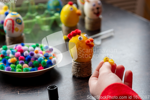 Image of A child makes gifts with his own hands for Easter, a decorative element in the child\'s cancer