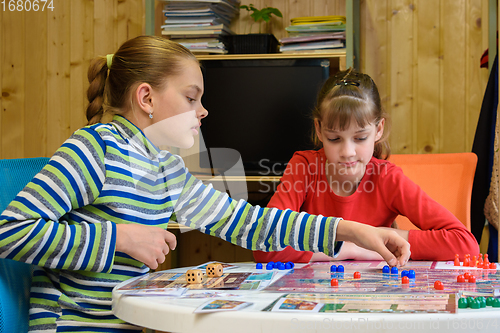 Image of Two girls playing a board game