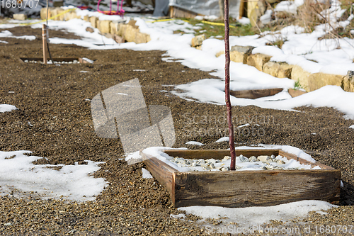 Image of Spring thaw, snow melts on the backyard