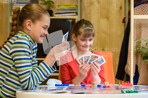 Image of Happy kids playing board games