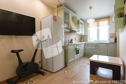 Image of Interior of a spacious living room combined with a kitchen