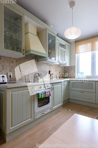 Image of Interior of a modern corner kitchen in an apartment