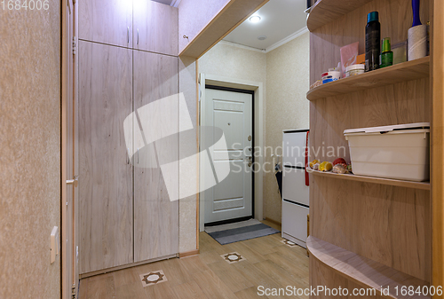 Image of Interior of a classic hallway room with a large wardrobe in a studio apartment
