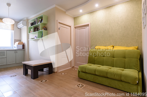 Image of Interior of a living room combined with a kitchen in a two-room apartment