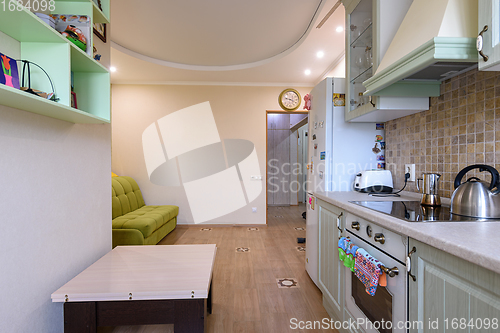 Image of Entrance hall combined with the kitchen, view from the kitchen side