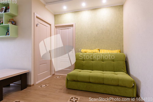 Image of The interior of a walk-through living room in a two-room apartment