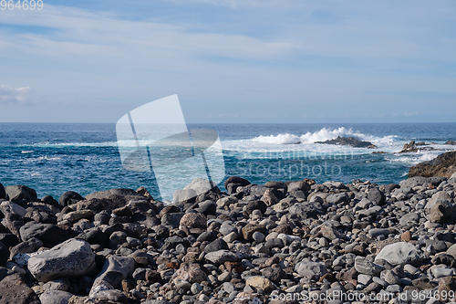 Image of beautiful wild beach with black sand