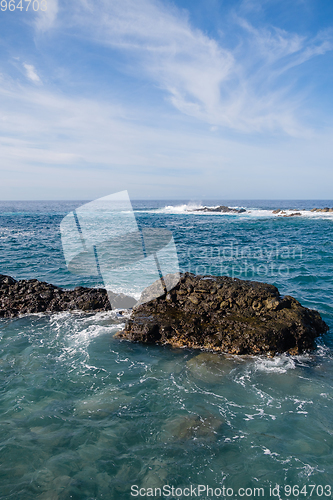 Image of beautiful wild beach with black sand