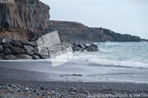 Image of beautiful wild beach with black sand