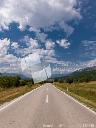 Image of asphalt road in beautiful countryside