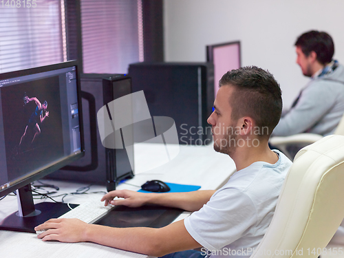 Image of Graphic Designer Working at Workplace