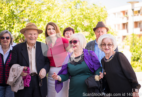 Image of group portrait of senior people with geriatric nurse