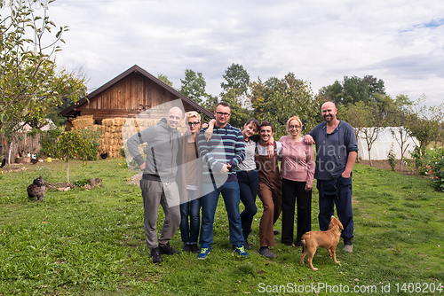 Image of portrait of happy family at farm