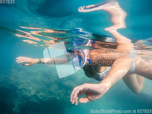 Image of woman snorkel in shallow water