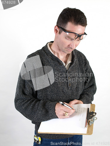 Image of Male Worker Taking Notes