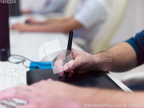 Image of Closeup of Graphic Designer Working at Workplace