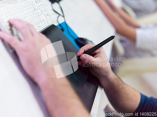 Image of Closeup of Graphic Designer Working at Workplace