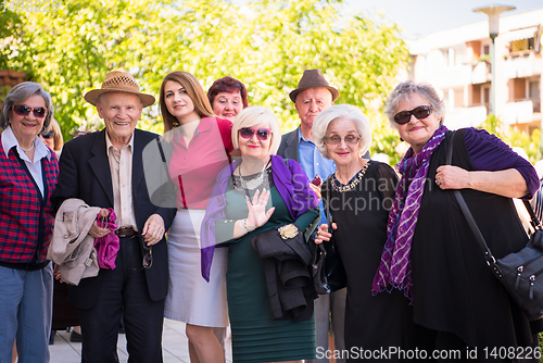 Image of group portrait of senior people with geriatric nurse