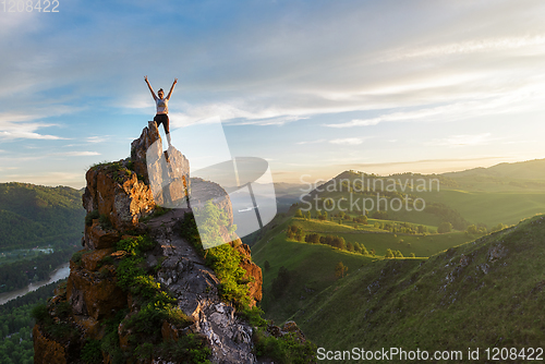 Image of Woman on top mountain in Altai