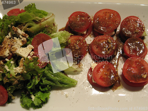Image of tomato dish and salad