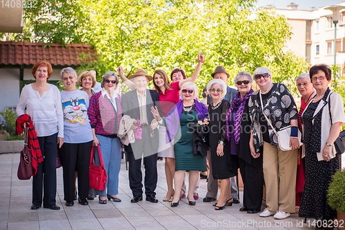 Image of group portrait of senior people with geriatric nurse