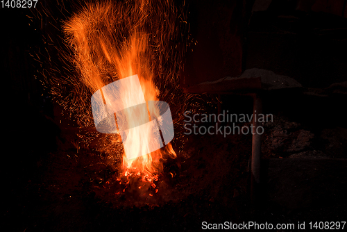 Image of Traditional blacksmith furnace with burning fire