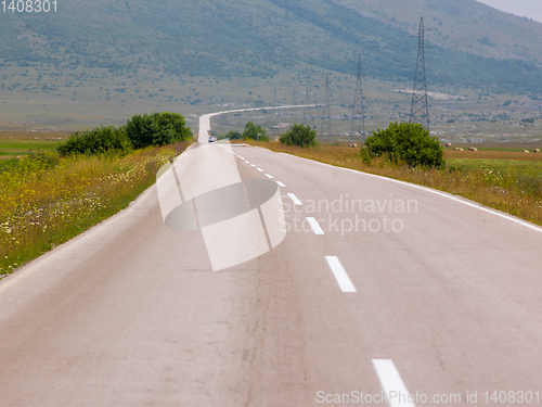 Image of asphalt road in beautiful countryside