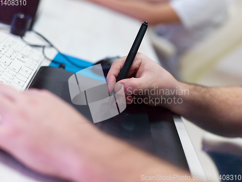 Image of Closeup of Graphic Designer Working at Workplace