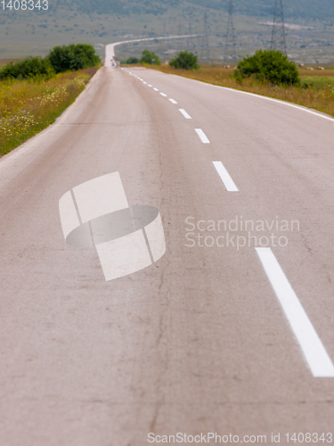 Image of asphalt road in beautiful countryside