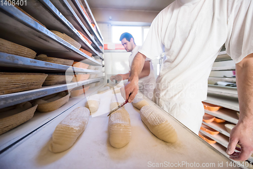 Image of bakers preparing the dough