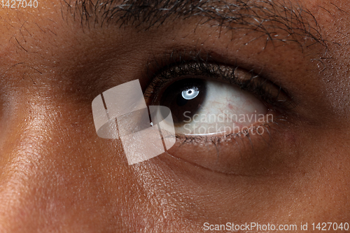 Image of Close up portrait of young man on blue background.