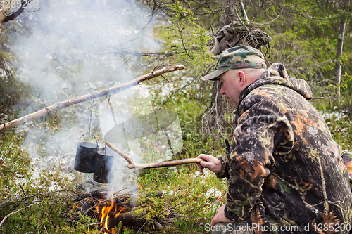 Image of Hunter has been cooking over a campfire