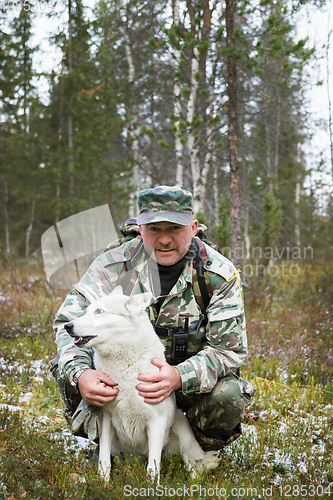 Image of Huntsman and his dog in the hunting grounds