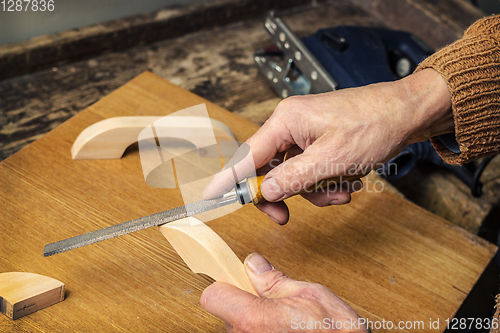 Image of Carpenter working in a workshop rasp