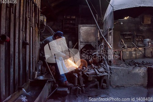 Image of the blacksmith polishing metal products