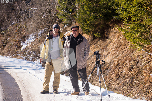 Image of portrait of two male photographer at winter nature