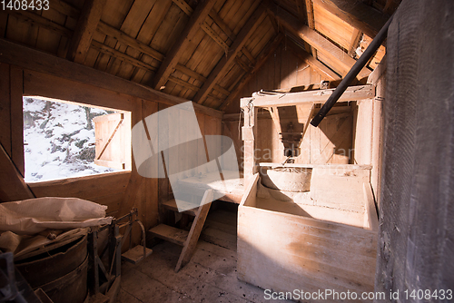 Image of interior of retro wooden watermill