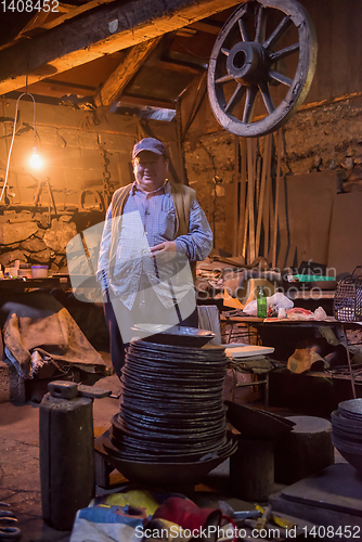 Image of portrait of confident senior blacksmith