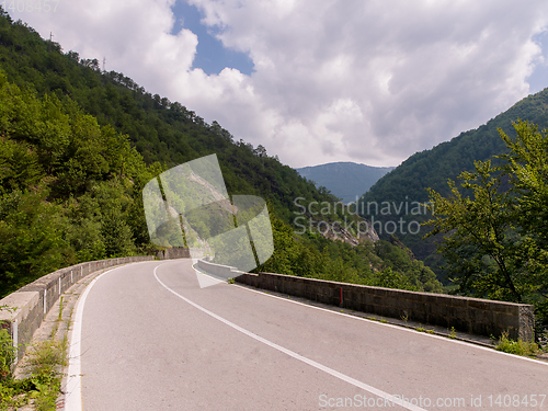 Image of asphalt road in beautiful countryside