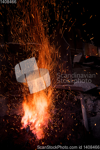 Image of Traditional blacksmith furnace with burning fire