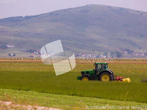 Image of Man driving tractor